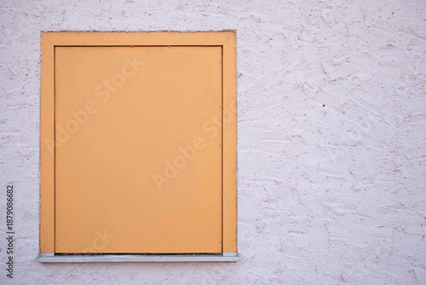 Fototapeta Closed window with shutter on textured wall
