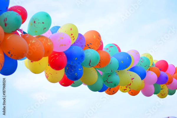 Obraz Bright colorful balloons with blue sky background.