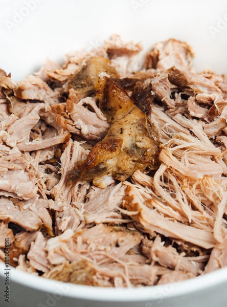 Fototapeta Traditional American Slow cooked Pulled pork made of boneless shoulder roast shredded with two forks cooked in crockpot or on bbq grill for Mexican Pork Carnitas, taco, tortillas or barbecue party