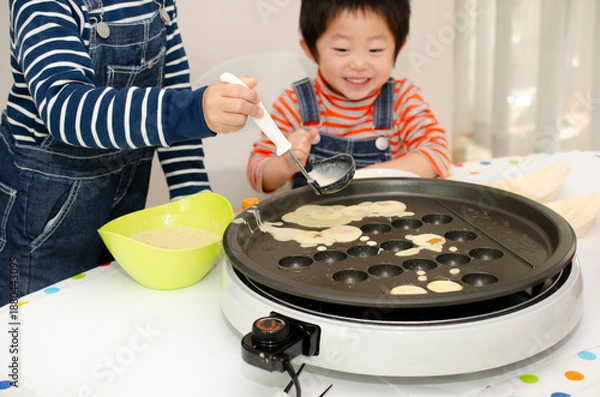 Obraz たこ焼を作る子供