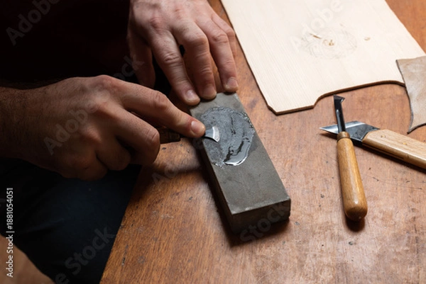 Obraz The master sharpens the cutting tool