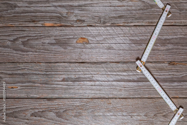 Obraz Rustic Wooden Workbench Background With Zigzag Folding Ruler
