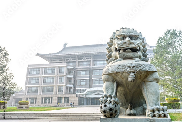Fototapeta Guardian lion in campus. Located in Peking University, Beijing, China.