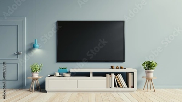 Fototapeta TV on the cabinet in modern living room have plants and book on blue wall background,3d rendering