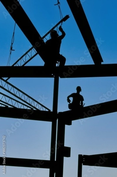 Obraz two workers setting steel