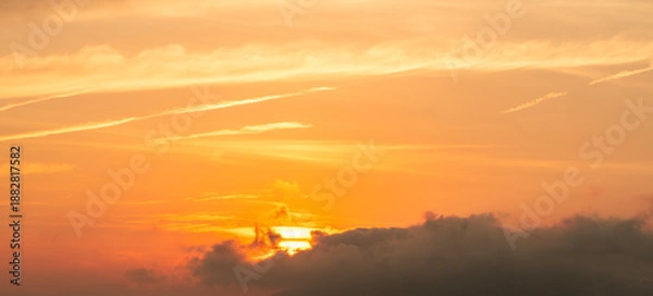 Obraz Beautiful bright orange sunset sky with clouds.
