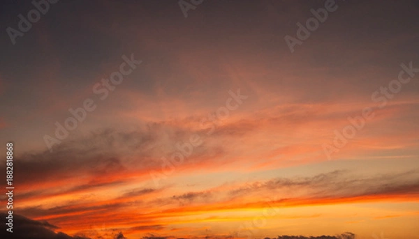 Obraz Beautiful bright orange sunset sky with clouds.