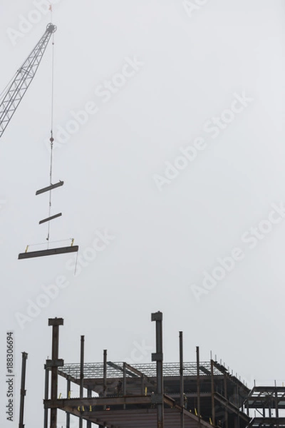 Obraz Steel construction with a working crane