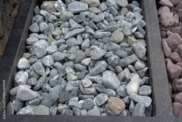 Obraz Smooth garden pebbles texture with dark border background