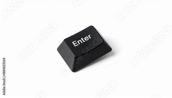 Obraz Single black “Enter” keyboard key slightly tilted on white background, emphasizing digital input and simplicity.