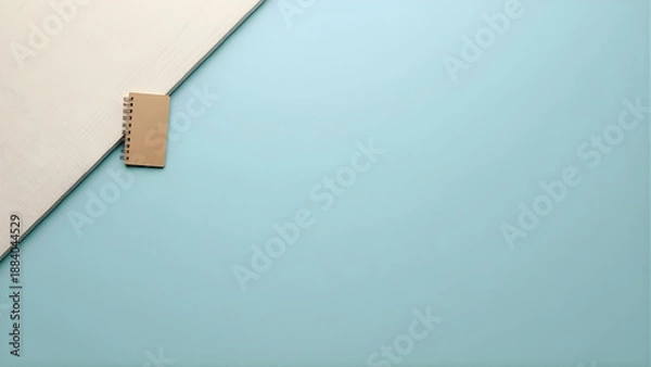 Obraz Notebook on a blue surface