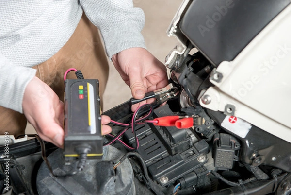 Obraz charging the battery of the motorcycle