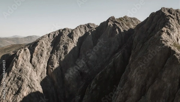 Obraz Jagged, rocky mountain range under a bright, cloudless, clear sky
