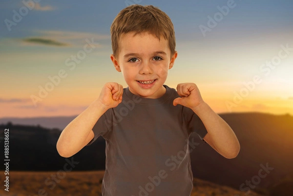 Obraz A young boy is pointing at a construction site
