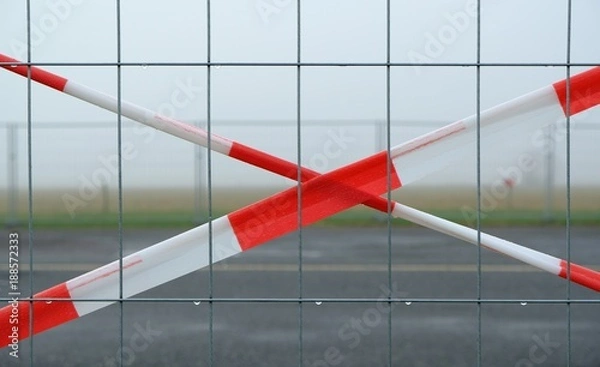 Obraz site fence with caution tape