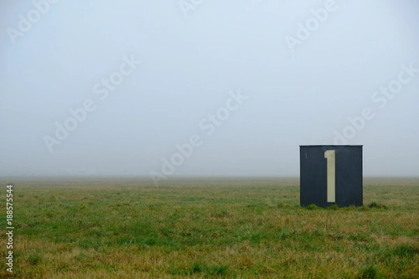 Obraz foggy field and the number one / airfield tempelhof in berlin