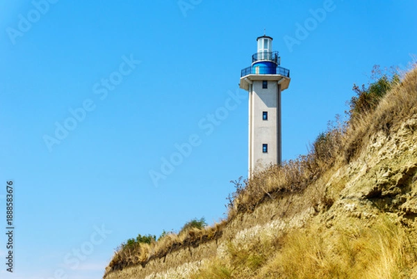 Obraz Lighthouse on the hill with blue empty sky
