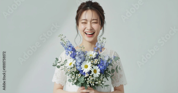 Obraz 白いレースドレスを着て花束を持つ美しい女性のポートレート	