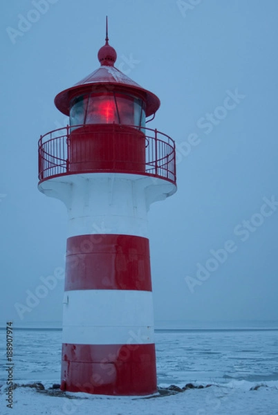 Obraz Lighthouse with light in winter