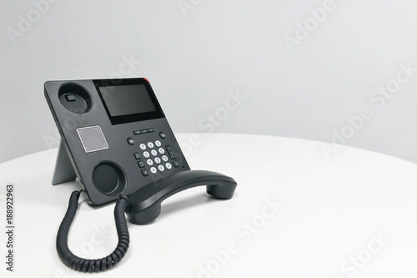 Fototapeta Black IP Phone, Office phone on the white table in the meeting room