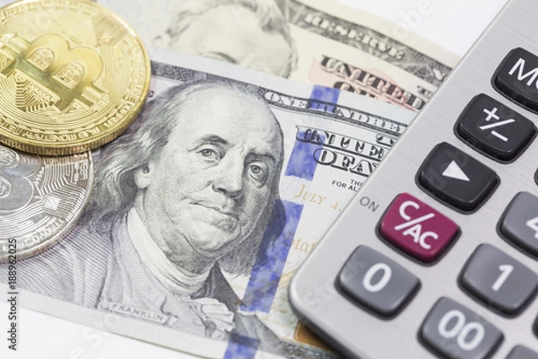 Fototapeta Bitcoins and dollars with calculator in background 