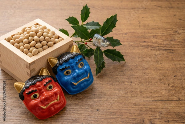 Obraz 節分の伝統的な豆まきセット、赤鬼と青鬼のお面の置物、福豆、柊鰯の飾りが並ぶ画像素材