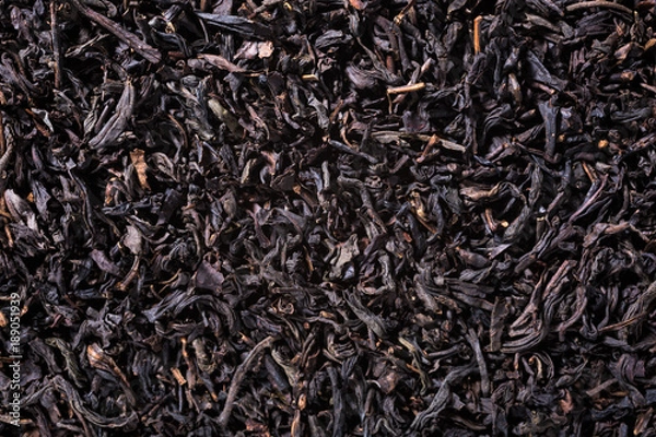 Fototapeta Background with black tea with copy space. Top view.