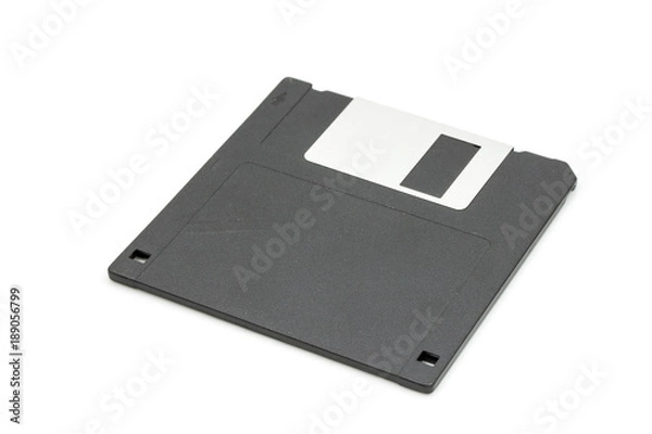 Fototapeta A black floppy disk isolated on white background, old technology for memory card