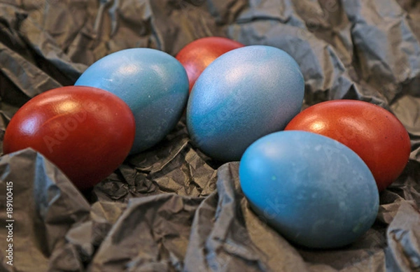 Obraz Hand-painted easter eggs on a black paper background
