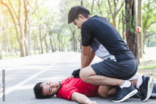 Fototapeta CPR with people with a heart attack in park