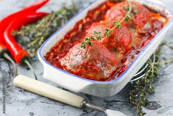 Obraz Baked meatballs from beef in tomato sauce with thyme
