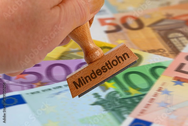 Obraz Holzstempel mit der Aufschrift "Mindestlohn"