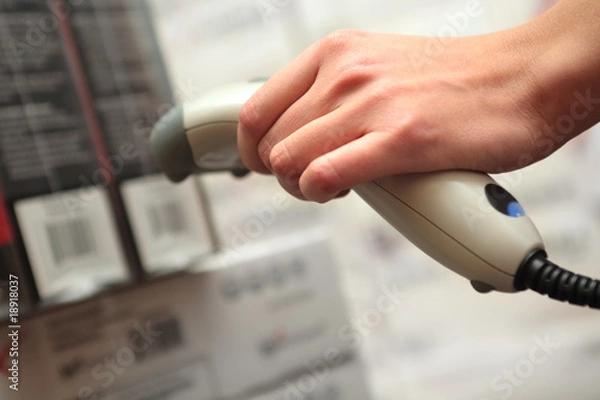 Obraz she works with barcode reader