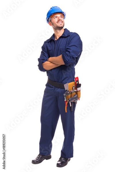 Fototapeta Full length of a young worker standing on a white background