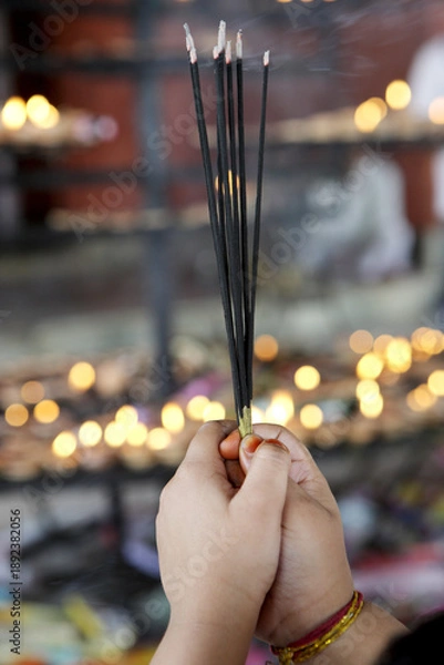 Obraz praying hands with incense sticks
