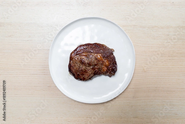 Obraz Freshly grilled beef steak on a plate.