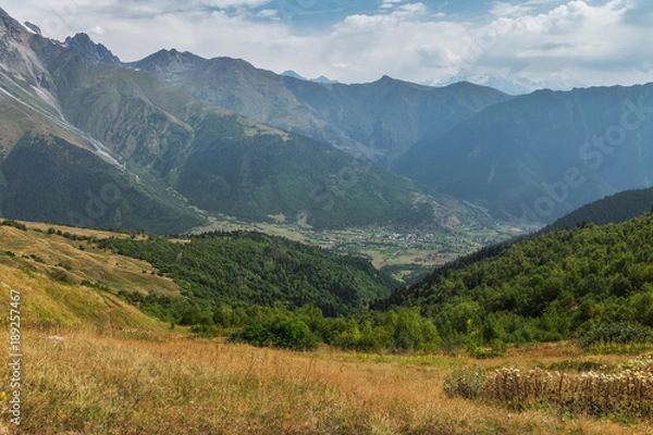 Fototapeta Small village between mountains