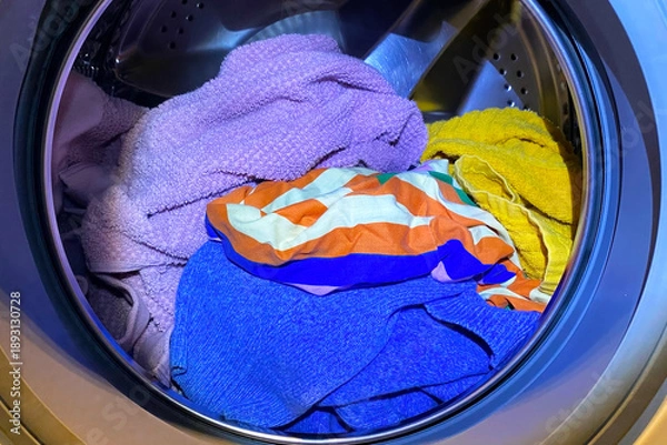 Obraz Colorful Laundry Inside a Washing Machine Drum