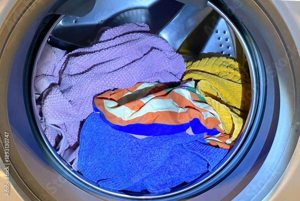 Obraz Colorful Laundry Inside a Washing Machine Drum