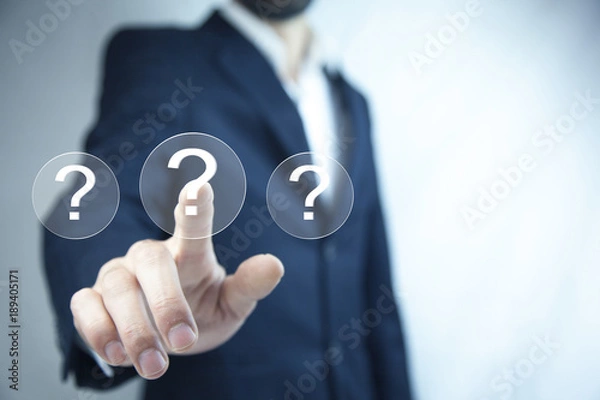 Fototapeta Man touching question mark in screen
