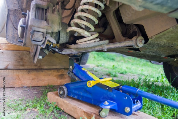 Obraz Broken spring in the car suspension.