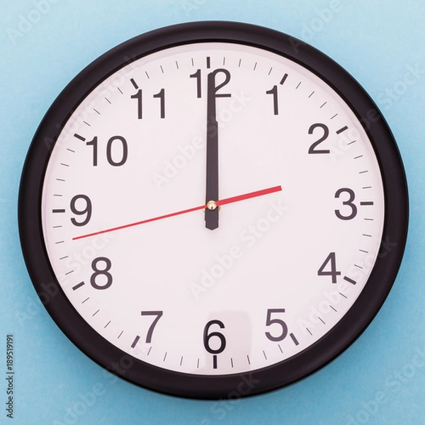 Obraz Wall clock isolated on blue background. Twelve o'clock