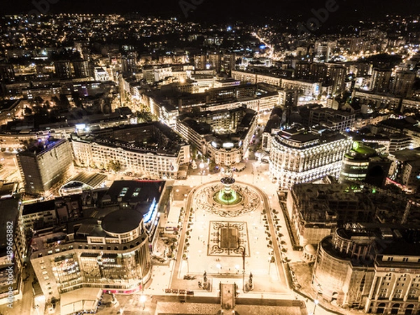 Fototapeta Aerial view of a square in a city downtown surrounded with ancient buildings