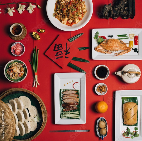 Fototapeta Concept picture for Chinese new year table set up and Chinese deish with Chinese word means fortune