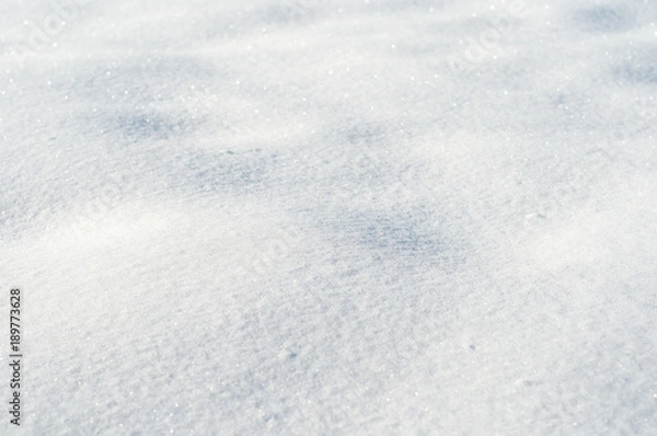 Obraz Texture of light fresh snow. Natural background of winter with blue snow.