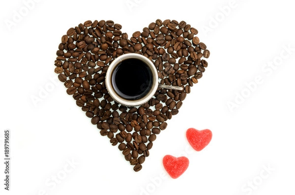 Fototapeta white cup with coffee beans and candy