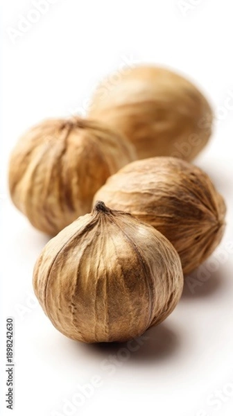 Fototapeta Three Dried Nuts On White Background