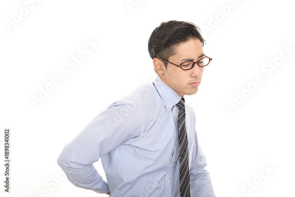 Obraz 腰痛に悩む男性