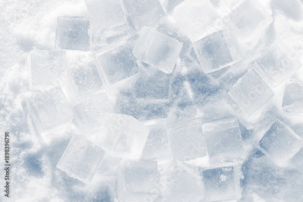 Obraz Ice cubes on a bright white snow background.