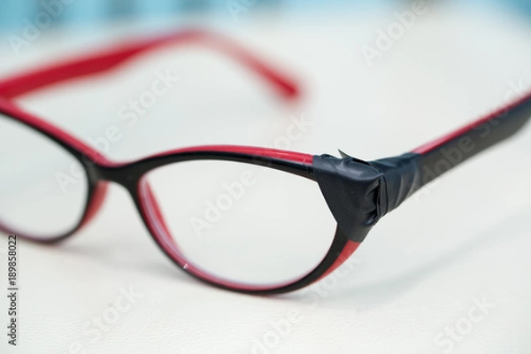 Obraz Broken Eyeglasses on White Background